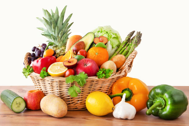 Fruits and vegetables in a basket stock photo
