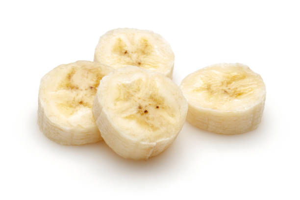 istock Sliced ripe banana isolated on white 1174793794