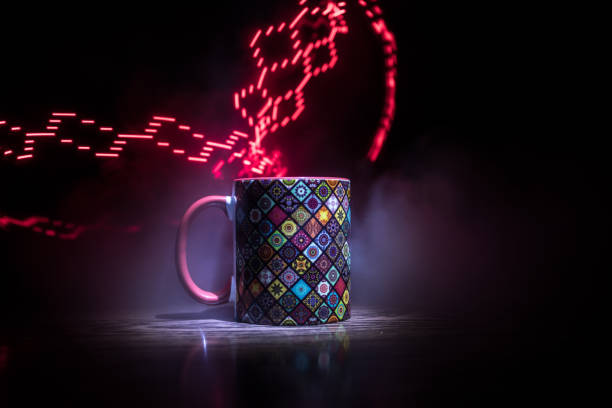 istock Beautiful eastern style textured ceramic cup of coffee (or tea) with smoke over dark toned background. 1174794256