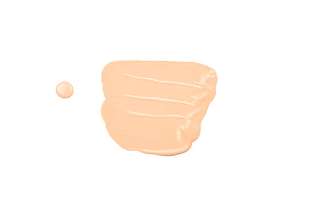 istock Liquid foundation smudge isolated on white background. Close Up of makeup cream sample. 1174795477