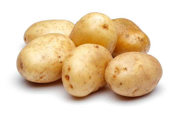 istock Group of fresh potatoes isolated on white 1174797678