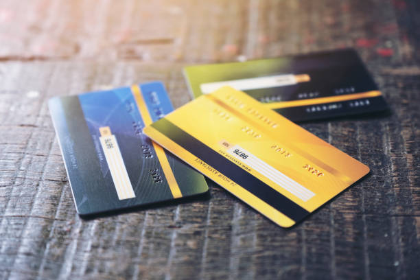 istock credit cards on wooden table 1174797999