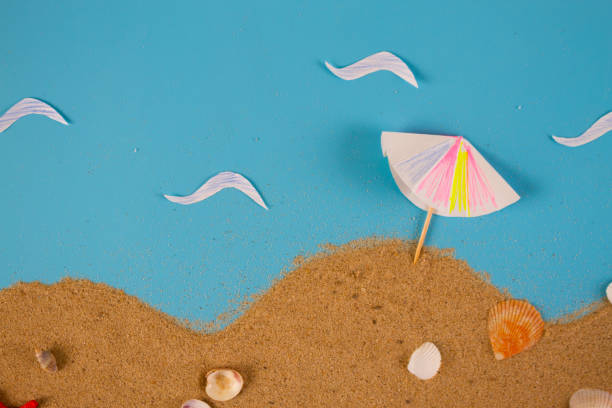 istock Striped beach umbrella on the beach. 1174799581