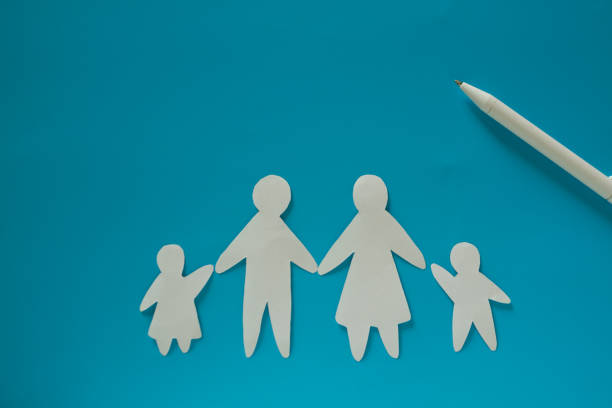 istock Paper family on blue background 1174800969