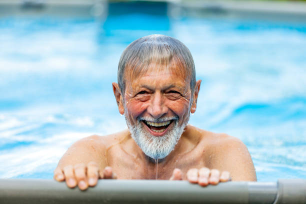 istock Senior retired male in a pool 1174801982