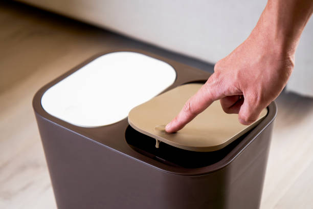 istock Press the open trash can lid with your finger 1174802285