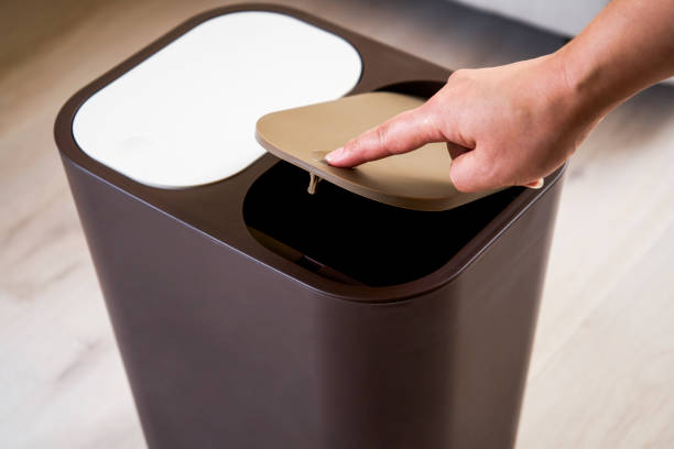 istock Press the open trash can lid with your finger 1174802288