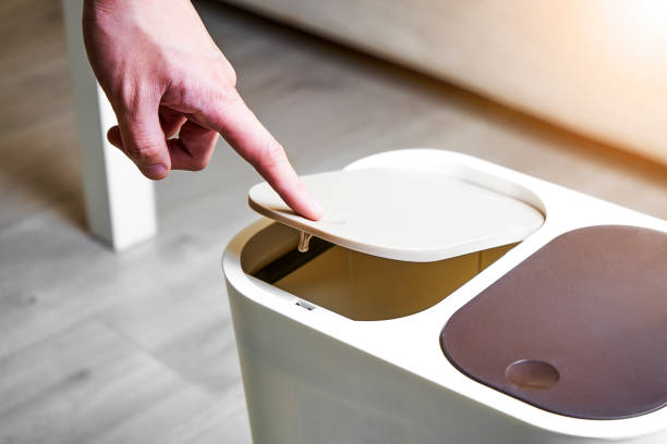 istock Press the open trash can lid with your finger 1174802291