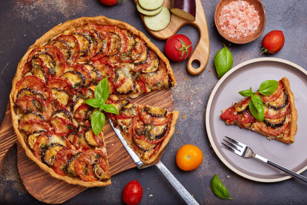 Quiche open tart pie with chicken meat tomatoes, eggplant and cheese Delicious homemade quiche open tart pie with chicken meat tomatoes, eggplant and cheese. Savory taste ratatouille stock pictures, royalty-free photos & images