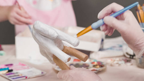 istock Painting with a white acrylic paint unicorn 1174804706