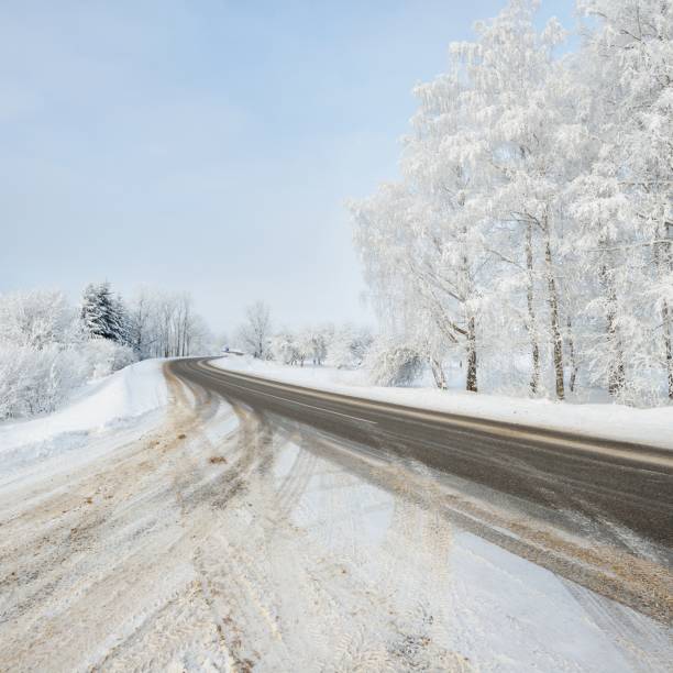 istock S-shape rural road through a winter wonderland with rime 1174805933