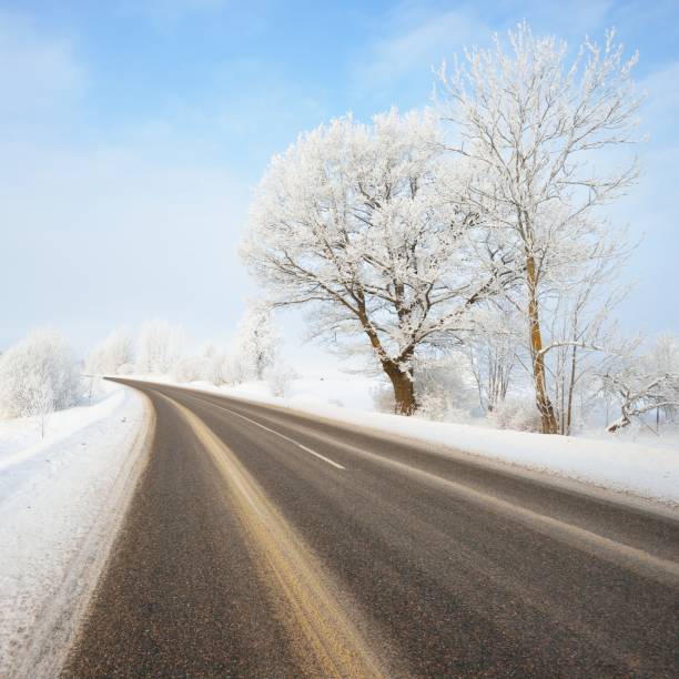 istock S-shape rural road through a winter wonderland with rime 1174805941
