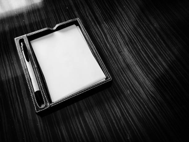 pen and paper on office desk