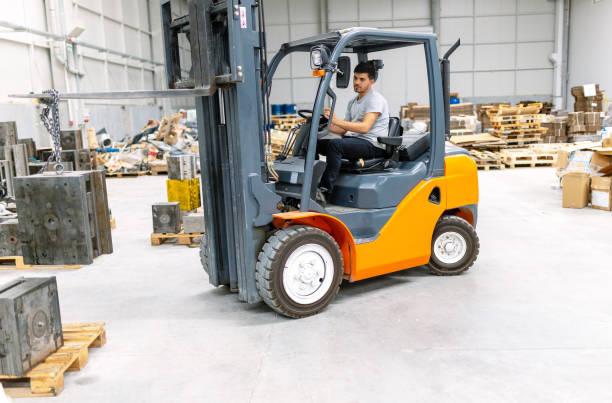 istock Man driving forklift in factory 1174807792