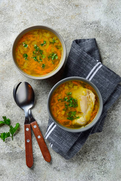 istock Chicken broth or soup with vegetable 1174809416