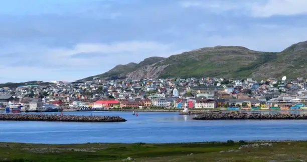 Saint Pierre city panorama, view from the Ile aux Marin past the harbor entrance towards the town of Saint Pierre, Saint Pierre and Miquelon