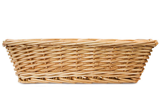 Rectangular wicker basket on white background  Wicker Basket shot from the front, isolated on white. basket stock pictures, royalty-free photos & images