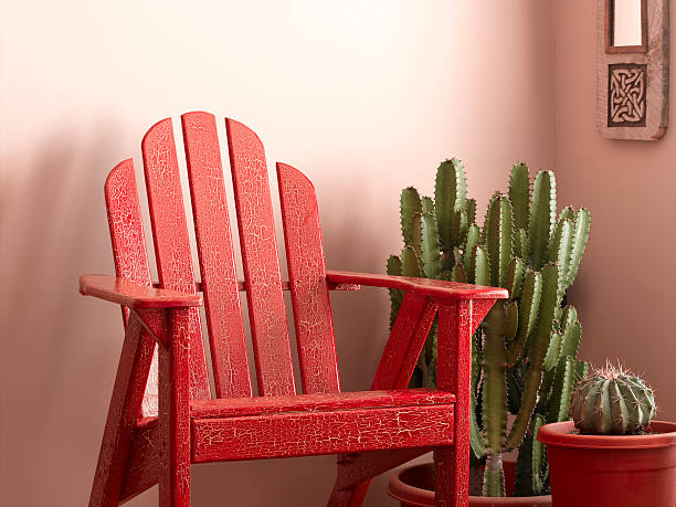 Adirondack Chair A colorful chair and cactus in a sun room. spanish flower pots stock pictures, royalty-free photos & images