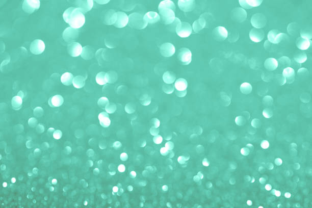 istock Green festive background with sparkles in the bokeh 1174812419