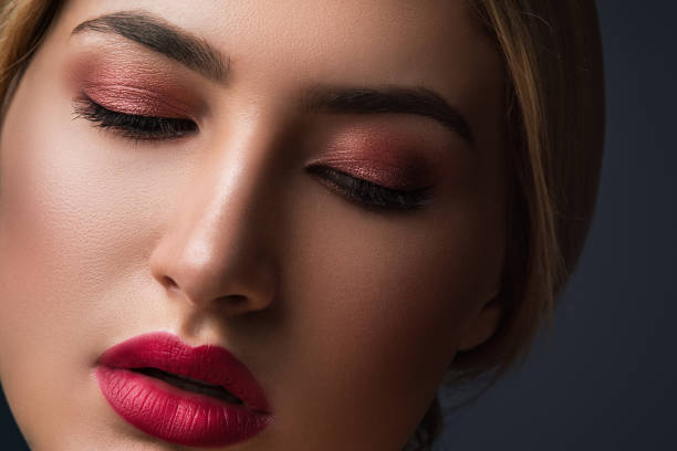 istock Beautiful blonde woman with red lips 1174812441