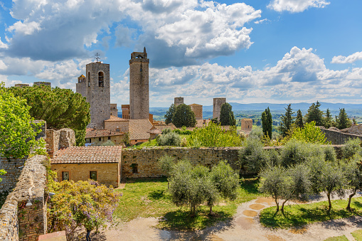 San Gimignano, Italy - April 25, 2016: Cityscape of San Gimignano with the Courtyard of the ancient fortress ruin in Italy