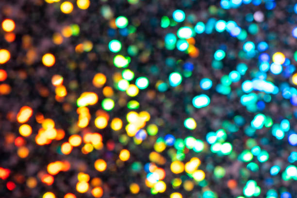 istock Colorful prism confetti blurred festive bokeh backdrop, trendy sparkles and glitter background, flat lay. Christmas and holidays concept, 2020 new year celebration 1174816611