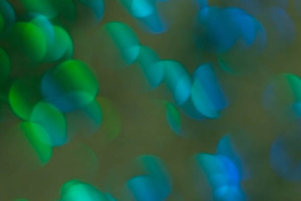 istock Colorful prism confetti blurred festive bokeh backdrop, trendy sparkles and glitter background, flat lay. Christmas and holidays concept, 2020 new year celebration 1174817347