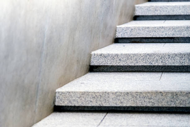 istock Grey staircase. The marble staircase with stone wall. 1174817464