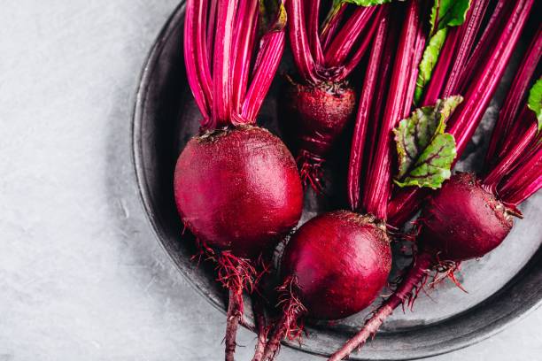 Bunch of fresh raw organic beets with leaves