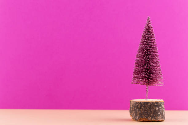 istock Christmas tree on pastel colored background. Christmas or New Year minimal concept. 1174820061