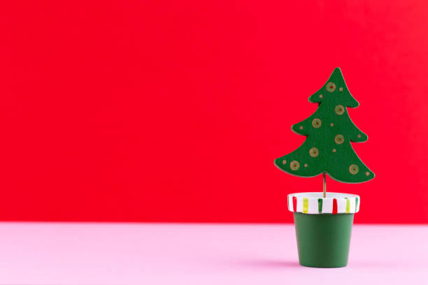 istock Christmas tree on pastel colored background. Christmas or New Year minimal concept. 1174820099