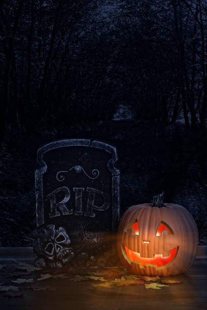 istock halloween pumpkin with grave headstone 1174820285