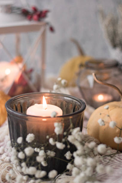 istock autumn cosy tea on tray with pumpkin, candles and blanket 1174821421