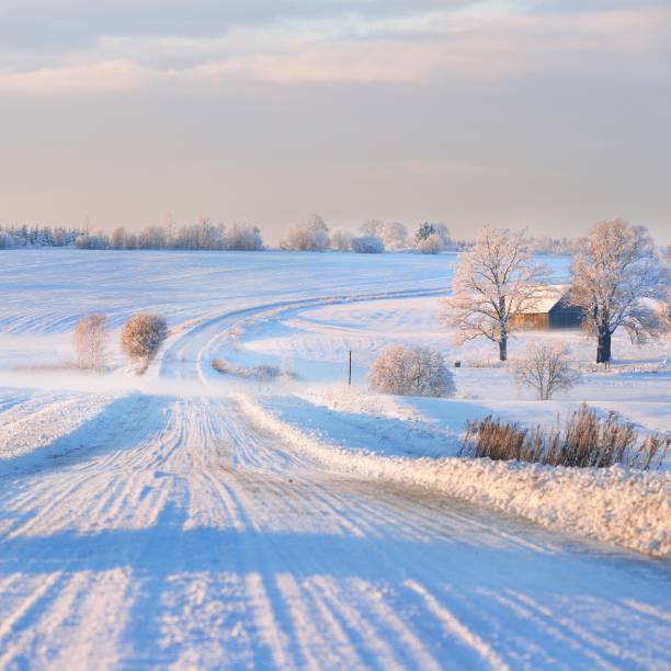 istock Fog over a snowcovered rural highway during winter sunset 1174822706