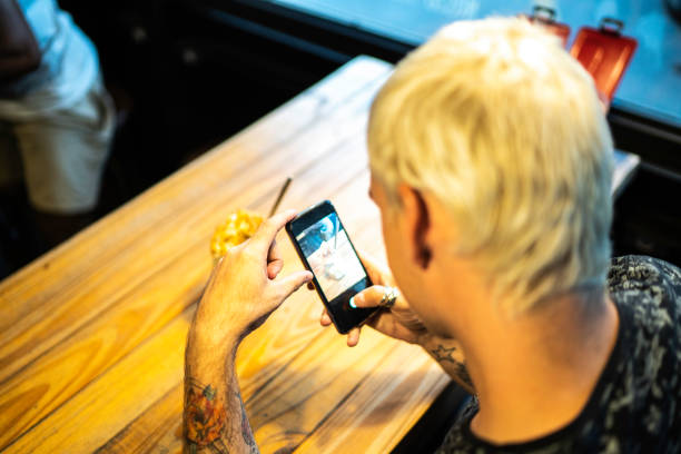 istock Young man taking picture of his milkshake 1174823255