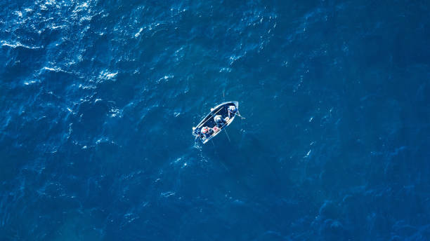 istock Sea surface with boat aerial view 1174825850