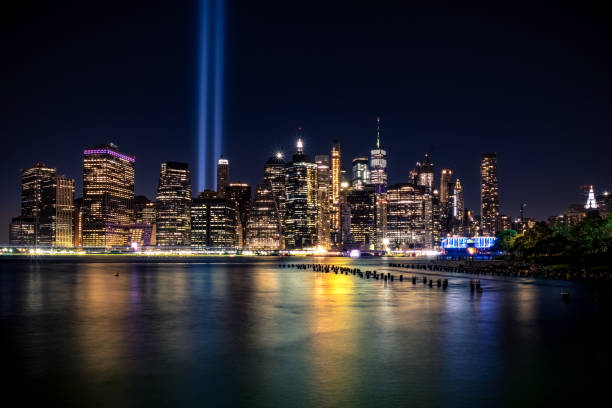 Lower Manhattan skyline from Brooklyn Lower Manhattan skyline at dusk from Brooklyn Bridge Park, Brooklyn, New York, USA to the struggle against world terrorism statue photos stock pictures, royalty-free photos & images