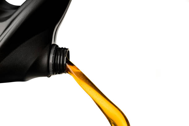 istock Pouring car oil  from bottle isolated on white background lubication engine transportation object design 1174829559