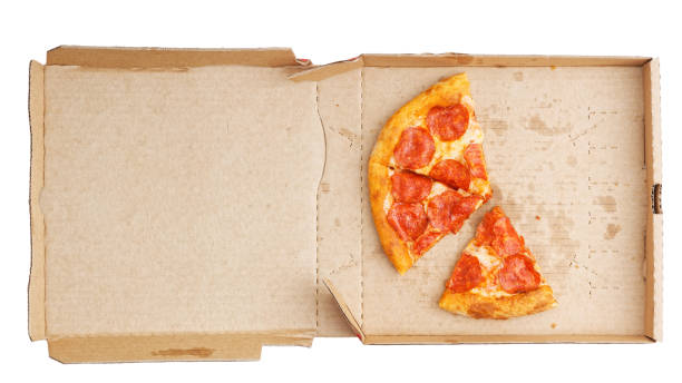 istock Closeup open box with pepperoni pizza leftovers isolated on white. Top view. 1174830234