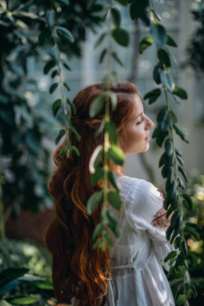 istock Dreamy woman in tropical environment 1174831323