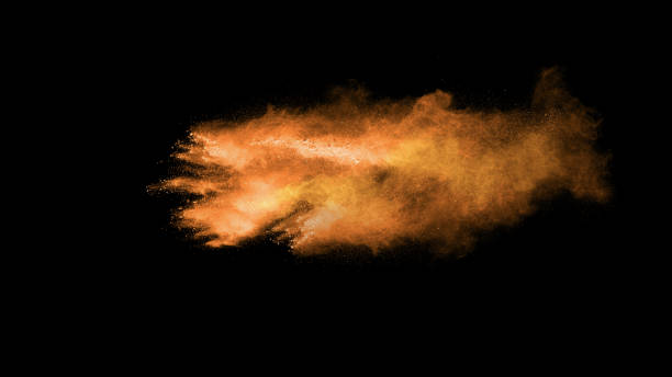 istock abstract orange powder explosion on black background. abstract orange dust splattered on  black background. Freeze motion of orange powder splash. 1174831335