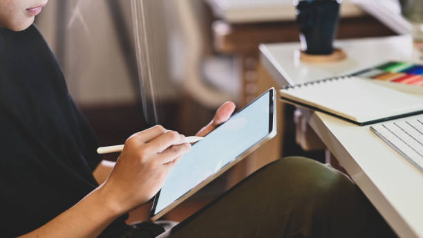istock Cropped shot young creative man working with tablet. 1174831828