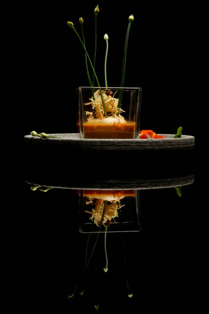 Prawn ballotine on lobster bisque. Exquisite dish. Creative restaurant meal concept. Haute couture food on black with reflection. Fine dining concept. Prawn ballotine on lobster bisque. Exquisite dish. Creative restaurant meal concept. Haute couture food on black with reflection. Fine dining concept. exclusive dinner stock pictures, royalty-free photos & images
