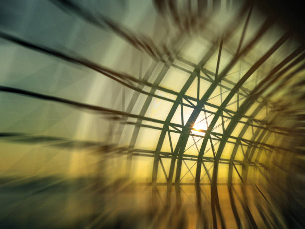 Abstract motion blurred background silhouette metal roof and wall construction of the airport at sunset.