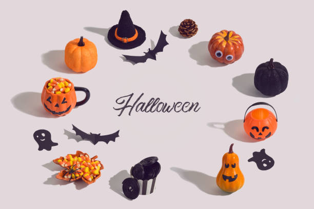 istock Halloween holiday creative background with jack o lantern, glitter pumpkin, candy corn and decorations 1174832666