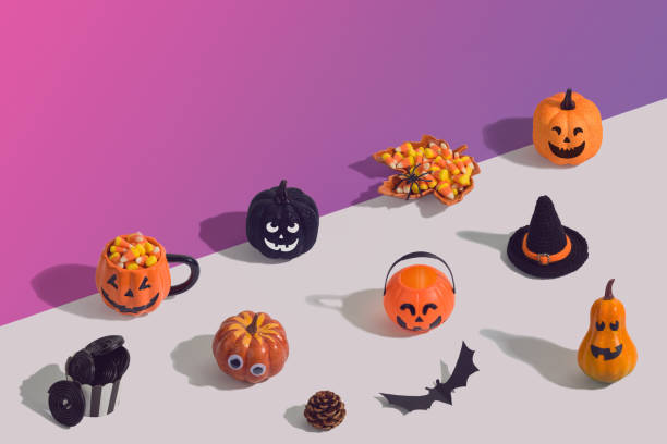 istock Halloween holiday creative background with jack o lantern, glitter pumpkin, candy corn and decorations 1174832716