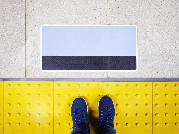 Woman standing on yellow floor tiles
