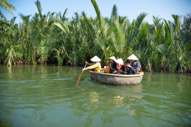 The tourist enjoy in basket boat 25-MAY-19, The tourist enjoy in basket boat made from bamboo at Cam Thanh village or coconut village. basket boat stock pictures, royalty-free photos & images