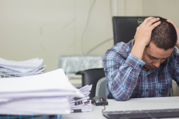 istock A man working hard burn out syndrome 1174836067