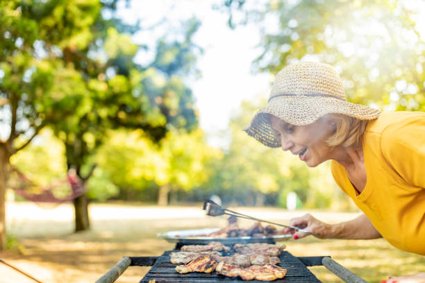 istock Preparing barbecue party outside in the backyard 1174836566